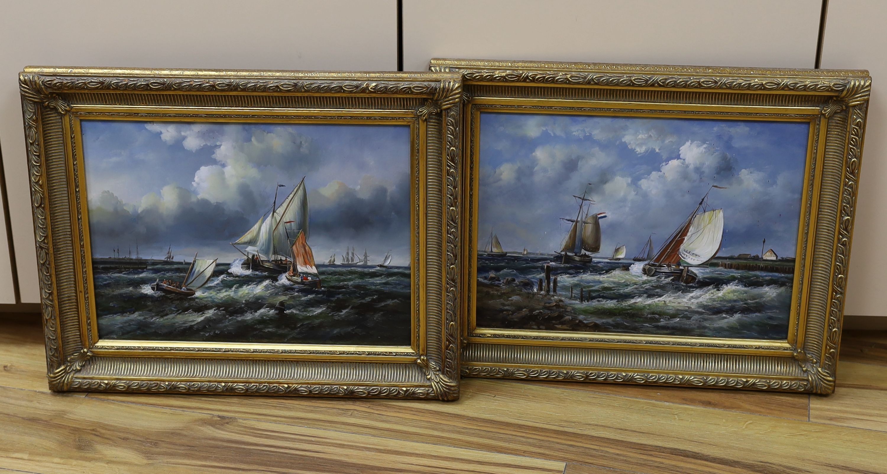 A pair of modern oils on panel of fishing boats at sea, 29 x 39cm